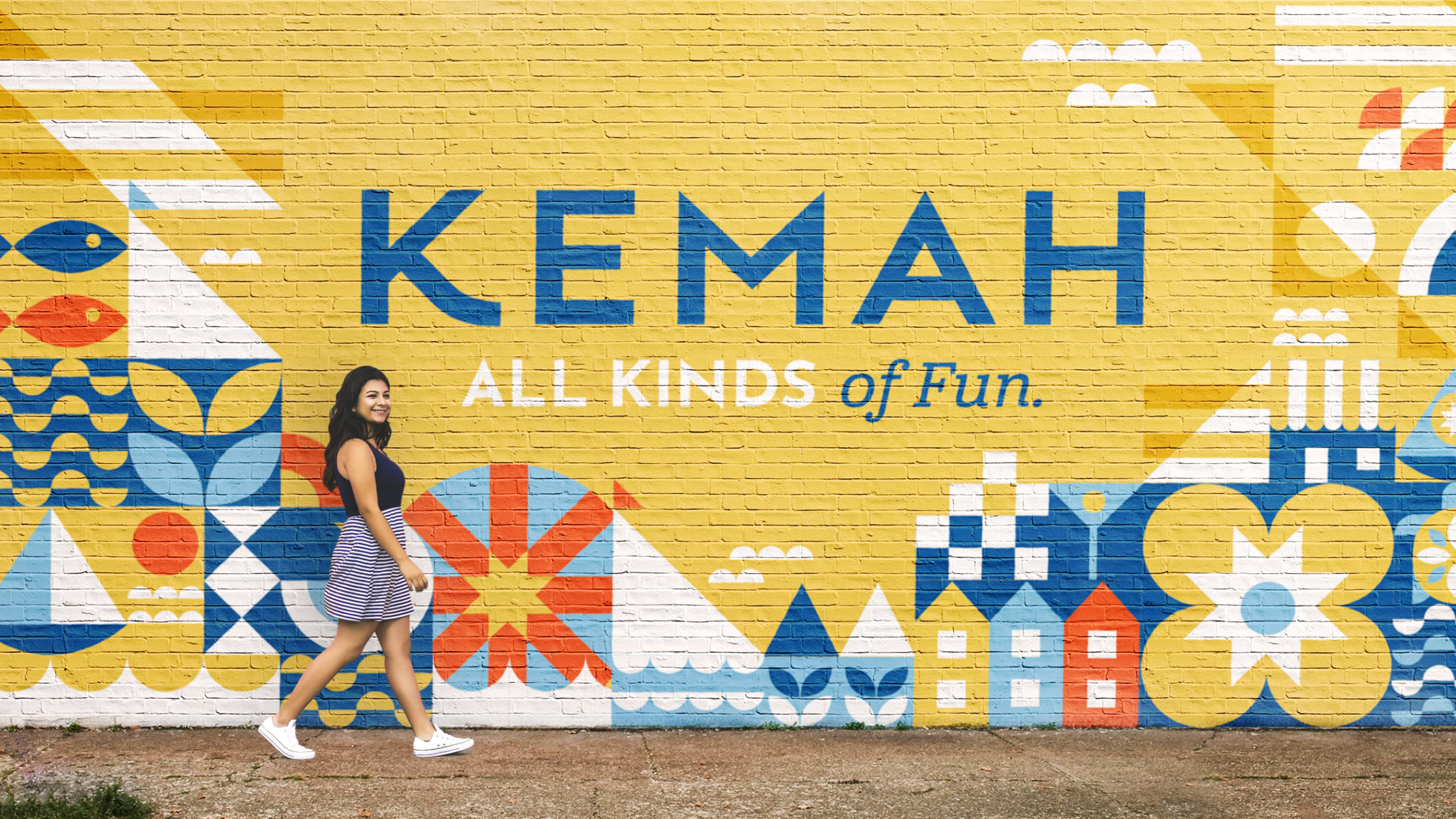 Showing a wall mural painted with the Kemah branding. Branding designed by MDR. Kemah is a small coastal town just outside of Houston.