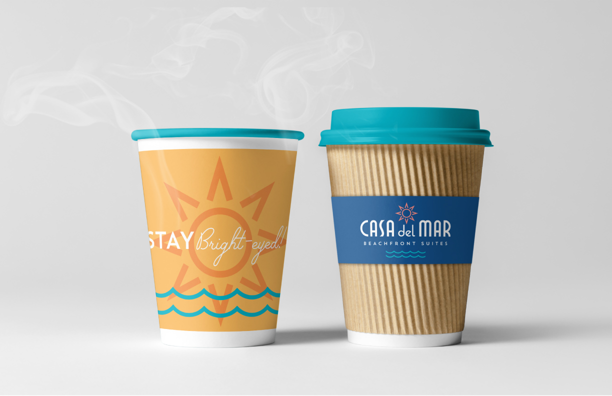 Showing a small complimentary coffee cup provided to guests by Casa del Mar. The cups feature branding designed by MDR.