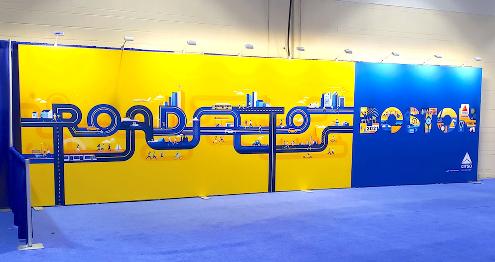 Showing the CITGO Road to Boston graphic MDR created for the Boston Marathon on display in a warehouse.
