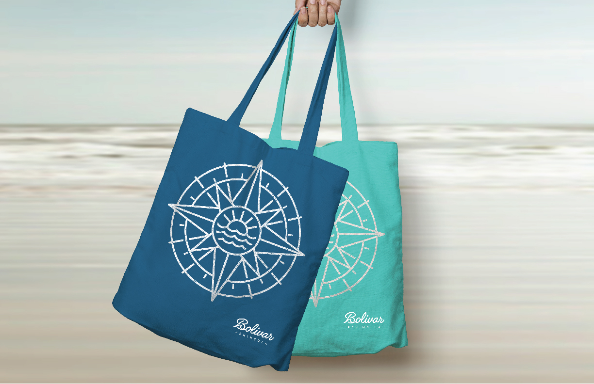 Showing the Bolivar Peninsula logo on two canvas bag.