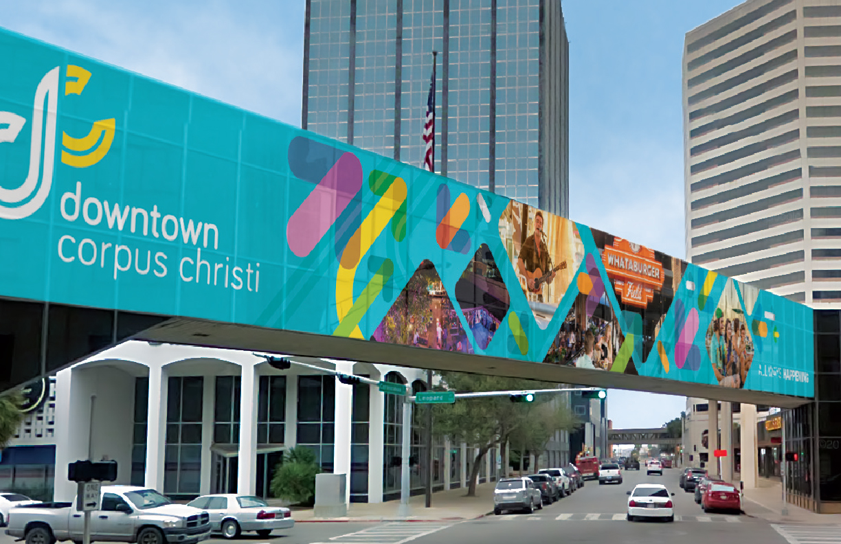 Showing a walkway covered in the Downtown Corpus Christi branding.