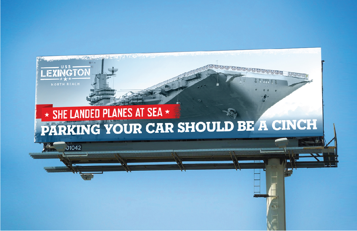 Showing a billboard for the USS Lexington.