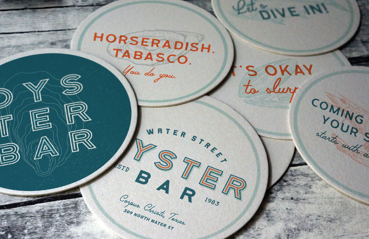 Showing Oyster Bar branded coasters with the Oyster Bar logo. Designed by MDR.