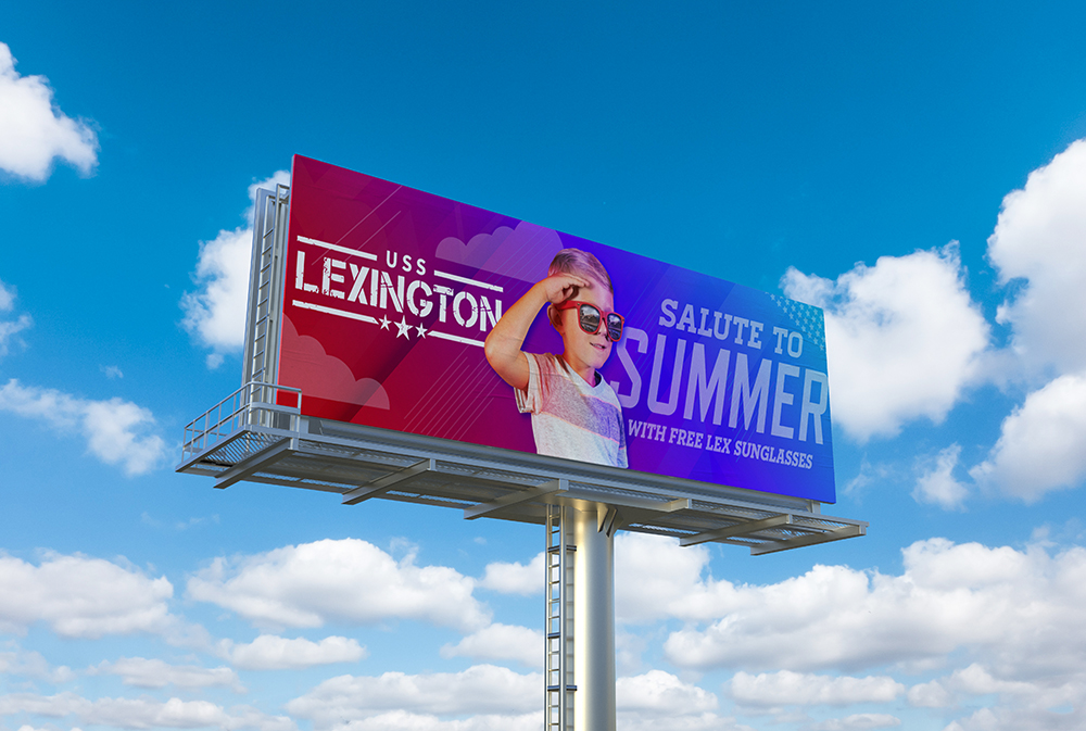 Showing the USS Lexington's Salute to Summer campaign displayed on a billboard.