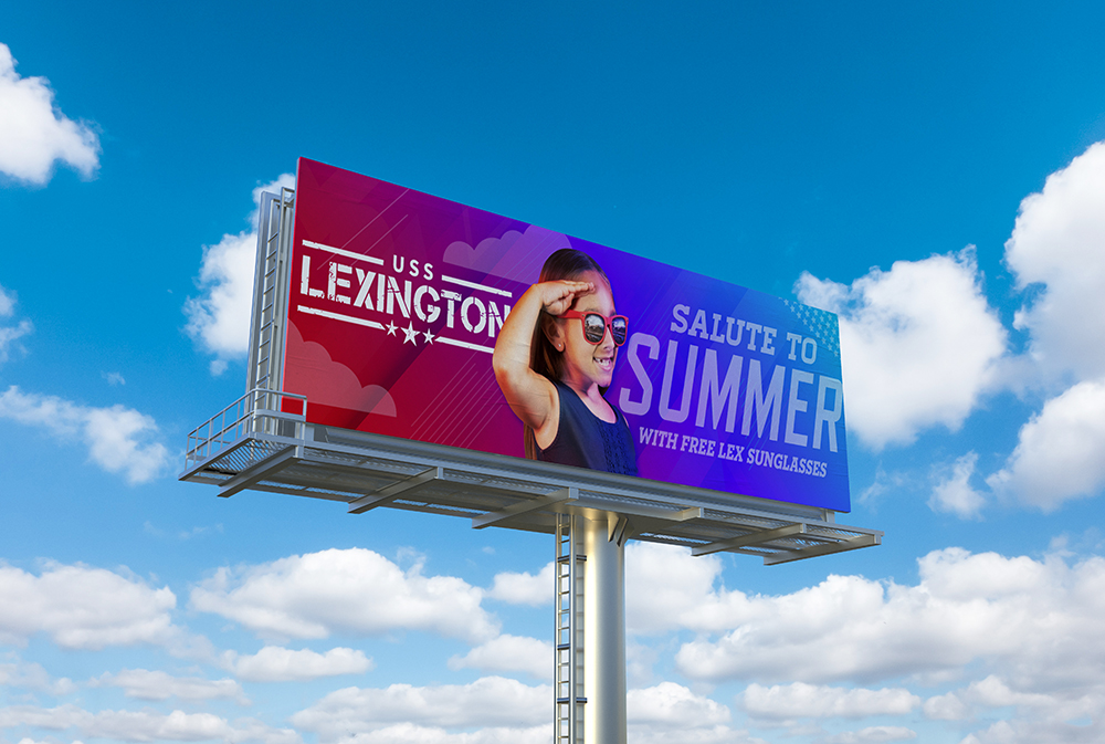 Showing the USS Lexington's Salute to Summer campaign displayed on a billboard.