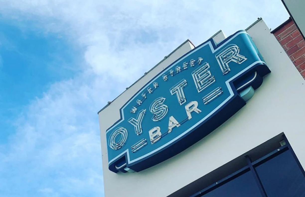 Showing the Oyster Bar exterior with neon sign logo as designed by MDR.